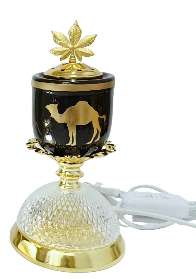 Decorative lamp and burner with gold accents and a camel design on a white background